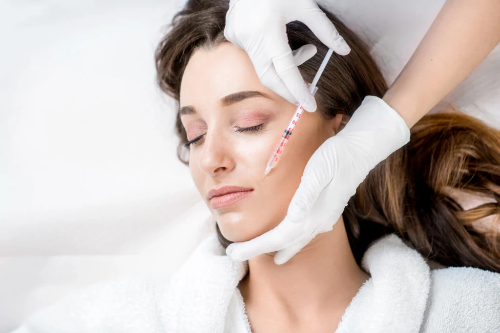 Woman getting a non-surgical facial rejuvenation procedure at Timelyss Med Spa in New York.