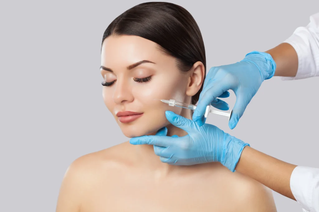 Skincare professional performing a facial contouring or lifting treatment at Timelyss Med Spa in New York.